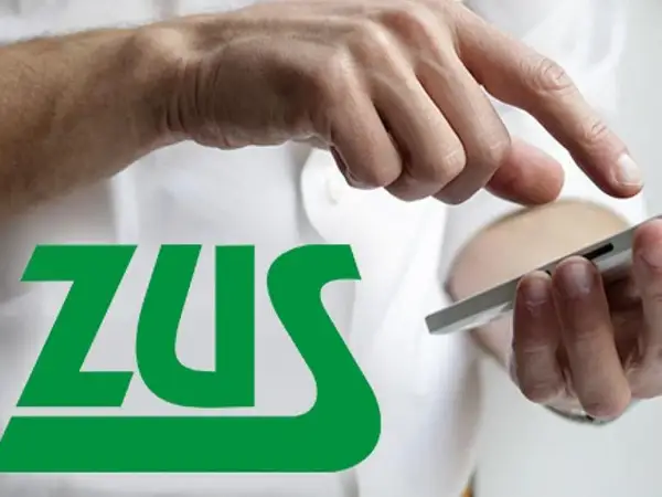 Dłoń z telefonem i logo ZUS. Sprawdź, jak ciąża a umowa zlecenie wpływa na Twoje prawa i obowiązki.