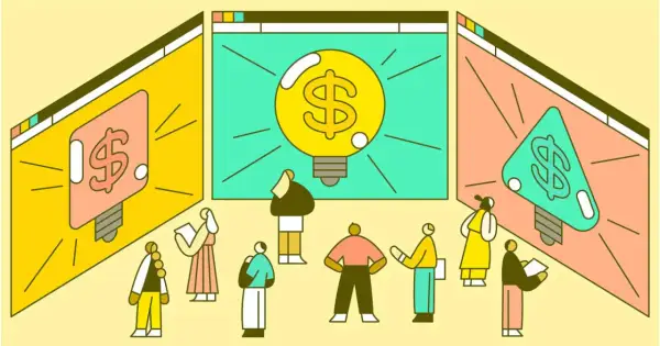 Ludzie patrzą na ekrany z żarówkami i symbolem dolara. To wizualizacja, jak działa crowdfunding co to jest: zbieranie funduszy na pomysł.